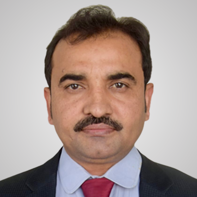 Professional headshot of a man in a suit and tie.
